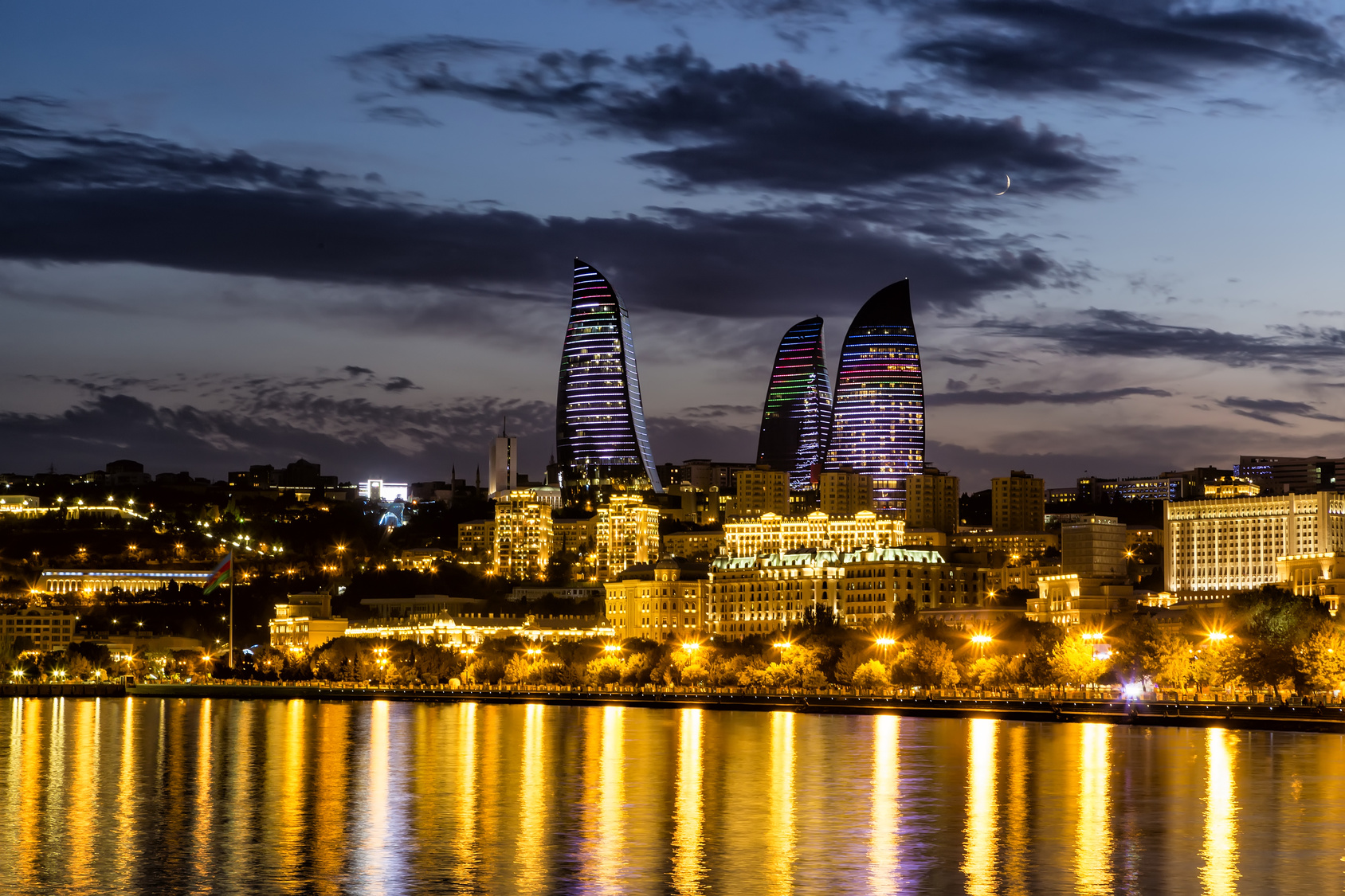 View of the waterfront and the city at night, in Baku, Azerbaija ...